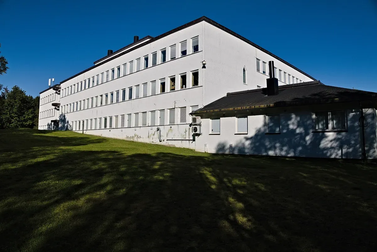 The white Tromsø Museum building on a clear day, a Sámi culture stop to pair with Tromso reindeer sledding
